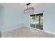 Bright dining area with sliding doors leading to the backyard at 174 Severin Se Rd, Port Charlotte, FL 33952