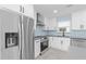 Modern kitchen with white cabinets and stainless steel appliances at 174 Severin Se Rd, Port Charlotte, FL 33952