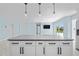 Kitchen island with white cabinets and grey countertop at 174 Severin Se Rd, Port Charlotte, FL 33952
