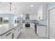 Modern kitchen with white cabinets and stainless steel appliances at 174 Severin Se Rd, Port Charlotte, FL 33952