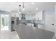 Modern kitchen with stainless steel appliances and light blue backsplash at 174 Severin Se Rd, Port Charlotte, FL 33952