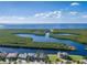 Aerial view of waterfront home with lush landscaping and private boat dock at 1120 La Palma Ct, Punta Gorda, FL 33950