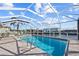 Inviting pool area with screened enclosure, offering ample space for relaxation at 1120 La Palma Ct, Punta Gorda, FL 33950