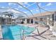 Inviting pool area with a screened enclosure at 1120 La Palma Ct, Punta Gorda, FL 33950