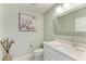 Modern powder room with white cabinets and quartz countertop at 1425 Park Beach Cir # 149, Punta Gorda, FL 33950