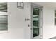 Condo building exterior, unit 149, featuring a modern door at 1425 Park Beach Cir # 149, Punta Gorda, FL 33950