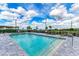 Inviting community pool with lounge chairs and a pergola at 1425 Park Beach Cir # 149, Punta Gorda, FL 33950