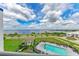 Community pool and spa with water views at 1425 Park Beach Cir # 149, Punta Gorda, FL 33950