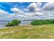 Serene waterfront view with lush greenery at 1425 Park Beach Cir # 149, Punta Gorda, FL 33950