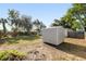 Backyard view of shed and grassy area at 22158 Marshall Ave, Port Charlotte, FL 33952