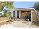 Front view of house with wooden gate and driveway at 22158 Marshall Ave, Port Charlotte, FL 33952