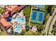 Aerial view of community pool and tennis courts at 2427 Daisy Dr, North Port, FL 34289