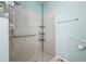 Bathroom features a large walk-in shower with grab bars at 2427 Daisy Dr, North Port, FL 34289