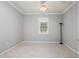 Empty bedroom with tile floors and a window with shutters at 2427 Daisy Dr, North Port, FL 34289