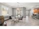 Bright dining room with glass table and chairs, near kitchen at 2427 Daisy Dr, North Port, FL 34289