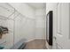 Large walk-in closet with wire shelving and a full-length mirror at 2427 Daisy Dr, North Port, FL 34289