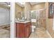 Bathroom with granite vanity, tiled shower, and modern fixtures at 2863 Mill Creek Rd, Port Charlotte, FL 33953