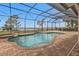 Screened pool and spa with brick pavers and lake view at 2863 Mill Creek Rd, Port Charlotte, FL 33953