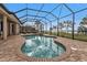 Relaxing kidney-shaped pool with brick coping at 2863 Mill Creek Rd, Port Charlotte, FL 33953