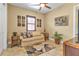 Relaxing sitting room with a sofa, decorative art, and tile floors at 2863 Mill Creek Rd, Port Charlotte, FL 33953