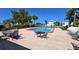 Community pool area with lounge chairs and patio tables at 311 Garvin St # 309D, Punta Gorda, FL 33950