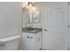 Small bathroom with granite countertop vanity at 3672 Vehlin St, North Port, FL 34286