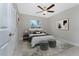 Bedroom with ceiling fan and large window at 3672 Vehlin St, North Port, FL 34286