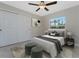 Bedroom with ceiling fan and sliding door closet at 3672 Vehlin St, North Port, FL 34286