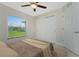 Bedroom with large window and sliding door closet at 3672 Vehlin St, North Port, FL 34286