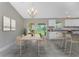 Kitchen dining area with light wood table and chairs, and a view to the backyard at 3672 Vehlin St, North Port, FL 34286