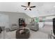 Bright living room with grey sofas and a round coffee table at 3672 Vehlin St, North Port, FL 34286