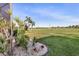 Landscaped backyard with tropical plants and a view of the golf course at 3818 Bordeaux Dr, Punta Gorda, FL 33950