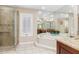 Spa-like bathroom with soaking tub and walk-in shower at 3818 Bordeaux Dr, Punta Gorda, FL 33950