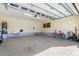 Bright and spacious garage with epoxy floor and ample storage at 3818 Bordeaux Dr, Punta Gorda, FL 33950