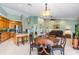 Open kitchen with island and adjacent dining area at 3818 Bordeaux Dr, Punta Gorda, FL 33950