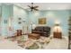 Living room with a leather couch and two armchairs at 3818 Bordeaux Dr, Punta Gorda, FL 33950