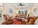 Relaxing sitting area with wicker furniture and large window at 3818 Bordeaux Dr, Punta Gorda, FL 33950