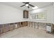 Unfinished bathroom with new flooring and ceiling fan at 429 W Ann St, Punta Gorda, FL 33950