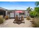 Beach-style patio with lounge chairs and red umbrella at 429 W Ann St, Punta Gorda, FL 33950