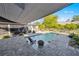 Relaxing pool area with patio chairs and shade structure at 429 W Ann St, Punta Gorda, FL 33950