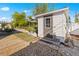 White storage shed in backyard with gravel area at 429 W Ann St, Punta Gorda, FL 33950