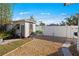 White storage shed with green kayak and gate at 429 W Ann St, Punta Gorda, FL 33950