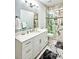 Bathroom with white vanity and marble shower at 340 N River Rd, Venice, FL 34293