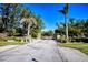 Gated entrance to the community with lush landscaping at 340 N River Rd, Venice, FL 34293