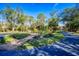 Landscaped circular driveway with manicured lawn and plants at 340 N River Rd, Venice, FL 34293