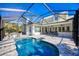 Inviting screened pool with spa and spacious patio at 340 N River Rd, Venice, FL 34293