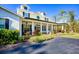 Spacious front porch with columns and seating area at 340 N River Rd, Venice, FL 34293