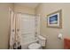 Bathroom with tub shower combo and seashell shower curtain at 1013 Live Oak Cir # 13, Port Charlotte, FL 33948