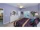 Purple bedroom with white dresser and king-size bed at 1013 Live Oak Cir # 13, Port Charlotte, FL 33948