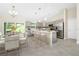 Modern kitchen with grey cabinets, white countertops, and island at 1548 El Paso Ave, North Port, FL 34286